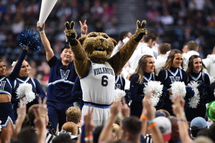Villanova Wildcats cheerleaders and mascot celebrate during a basketball game.
